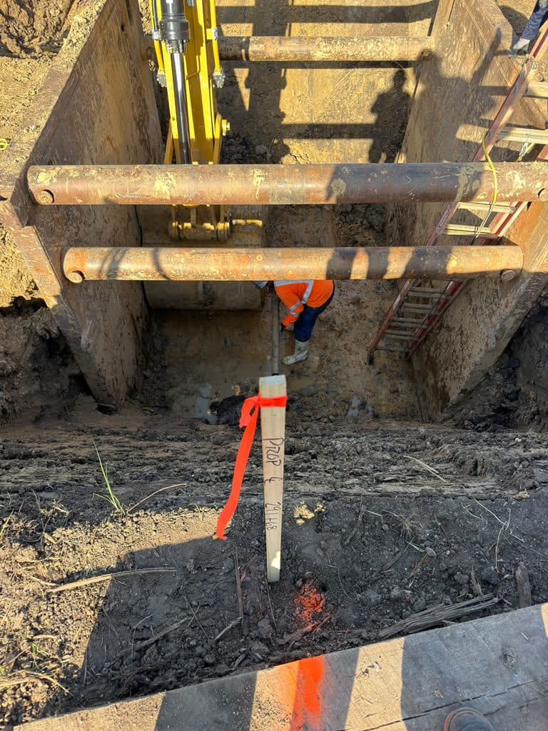 Shored excavation with struts and casing in place